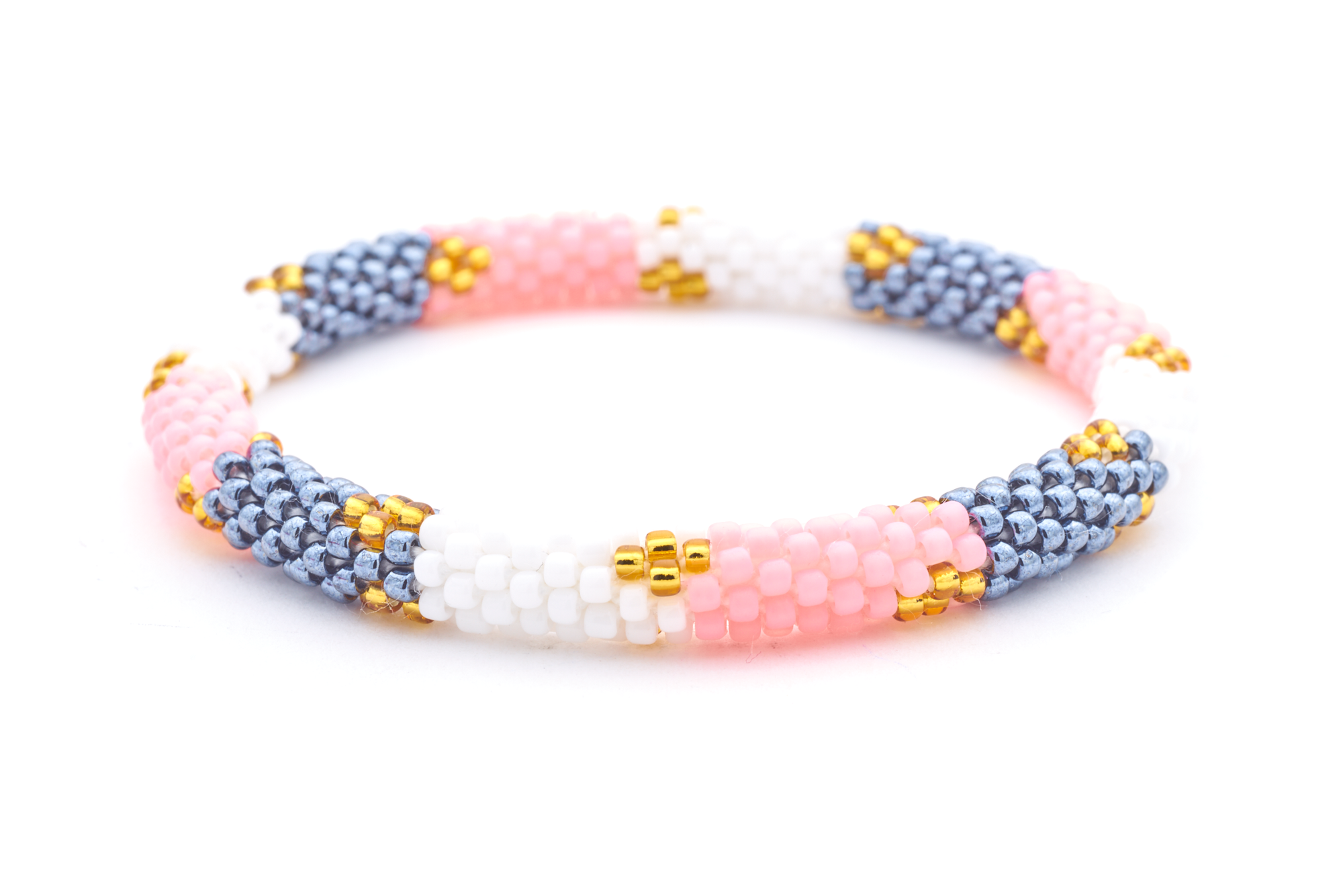 Sashka Co handmade beaded friendship bracelet with pink, white, silver, and gold glass beads. Crafted in Nepal by skilled artisans in a block diamond pattern.