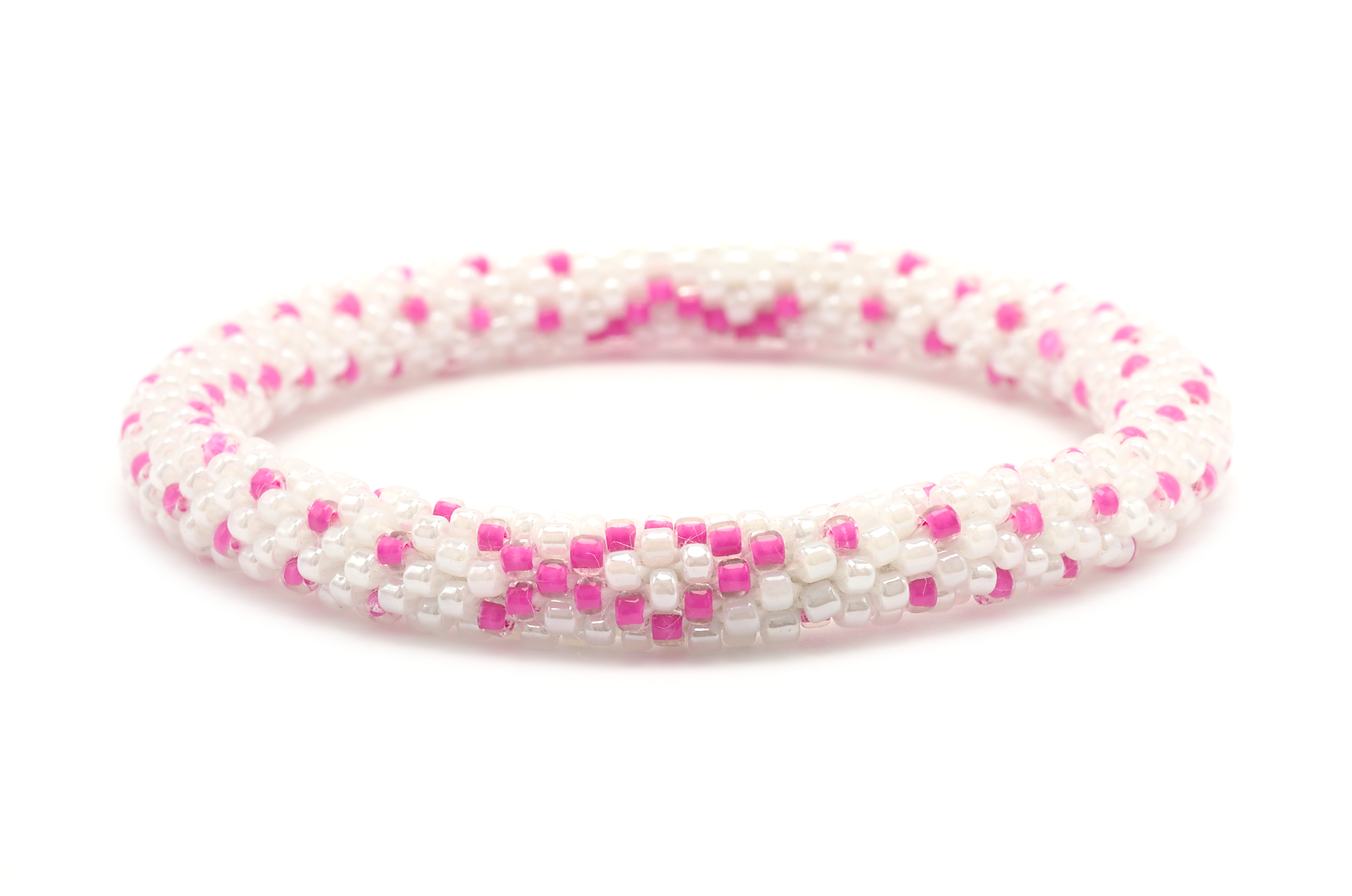Sashka Co handmade beaded friendship bracelet with pink and white glass beads. Crafted in Nepal by skilled artisans in a detailed ribbon pattern.
