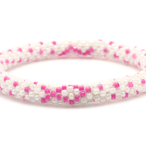 Sashka Co handmade beaded friendship bracelet with pink and white glass beads. Crafted in Nepal by skilled artisans in a detailed ribbon pattern.