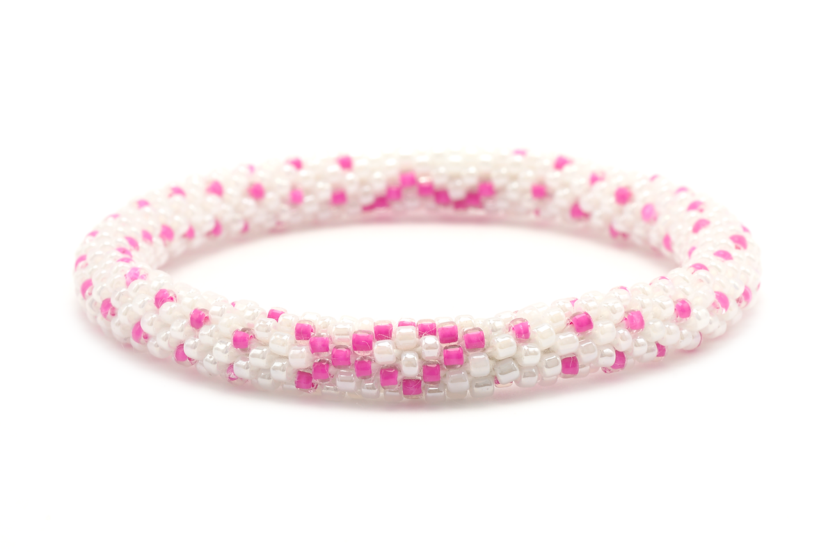 Sashka Co handmade beaded friendship bracelet with pink and white glass beads. Crafted in Nepal by skilled artisans in a detailed ribbon pattern.