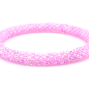 Sashka Co handmade beaded friendship bracelet with pink glass beads. Crafted in Nepal by skilled artisans in a solid pattern.