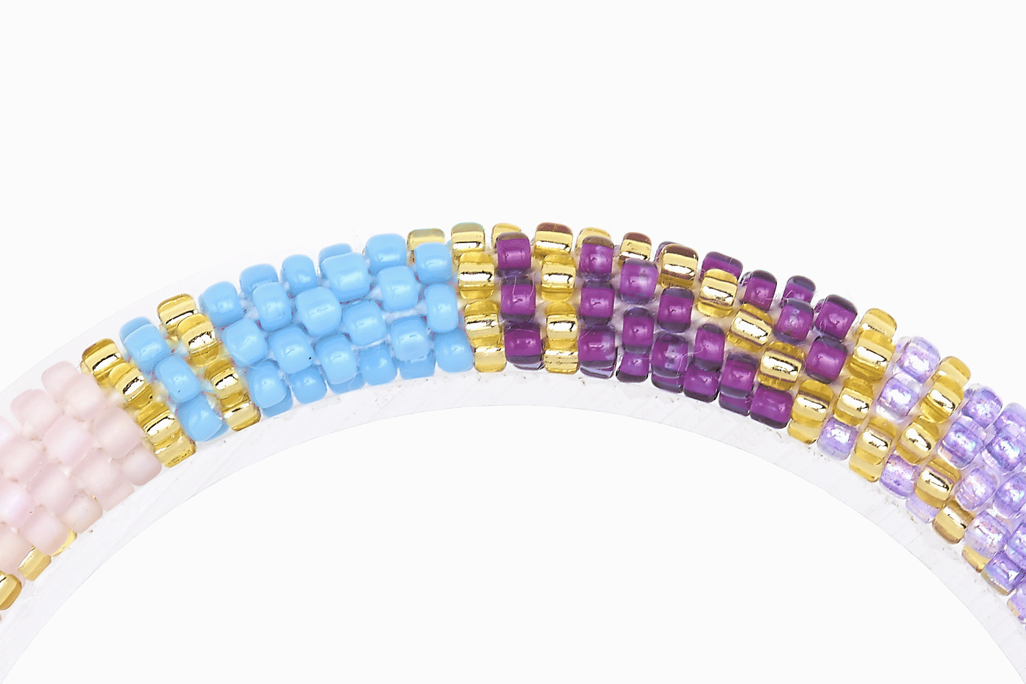 Sashka Co handmade beaded friendship bracelet with purple, blue, mint, pink, and gold glass beads. Crafted in Nepal by skilled artisans in a block spiral pattern.