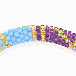 Sashka Co handmade beaded friendship bracelet with purple, blue, mint, pink, and gold glass beads. Crafted in Nepal by skilled artisans in a block spiral pattern.