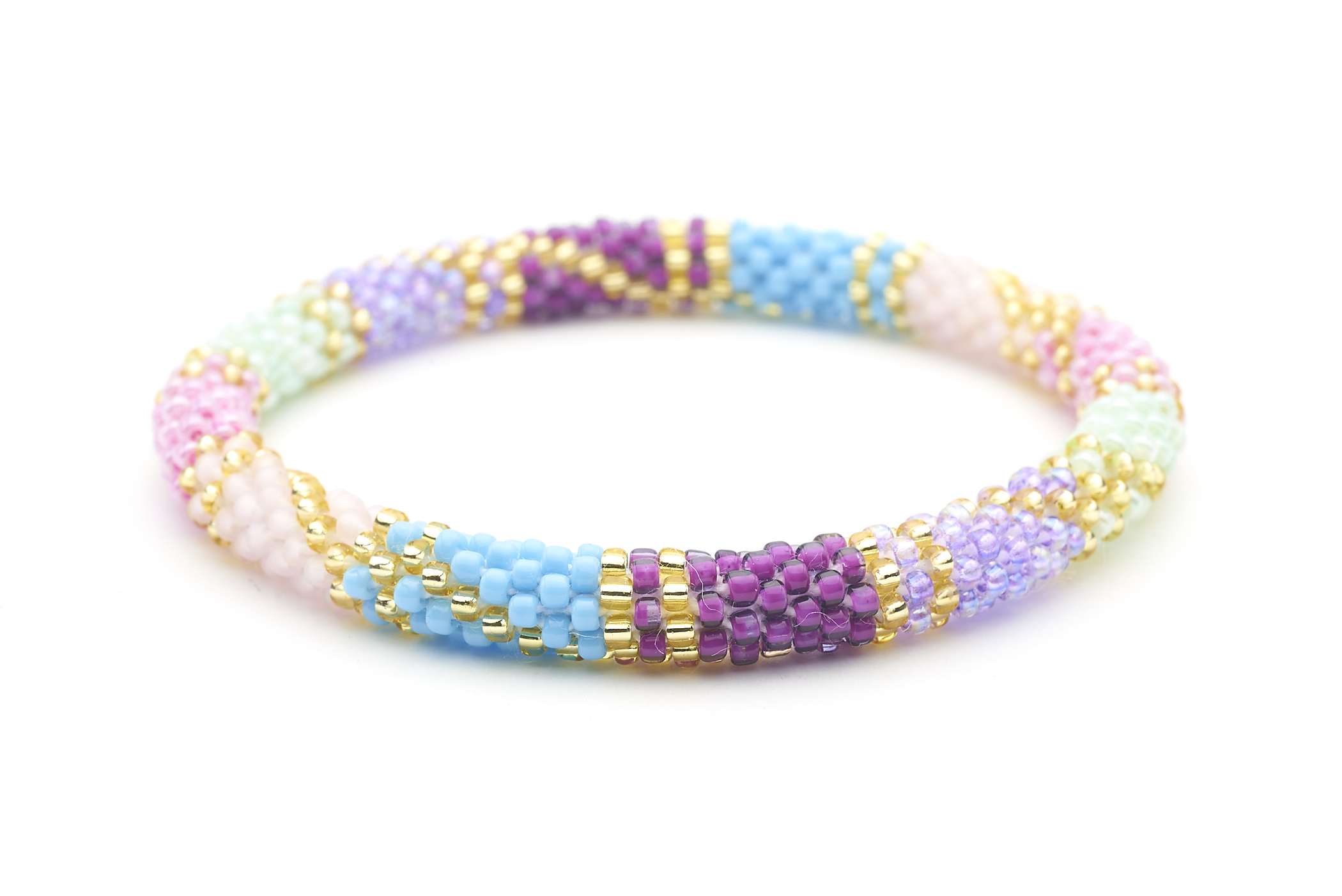 Sashka Co handmade beaded friendship bracelet with purple, blue, mint, pink, and gold glass beads. Crafted in Nepal by skilled artisans in a block spiral pattern.