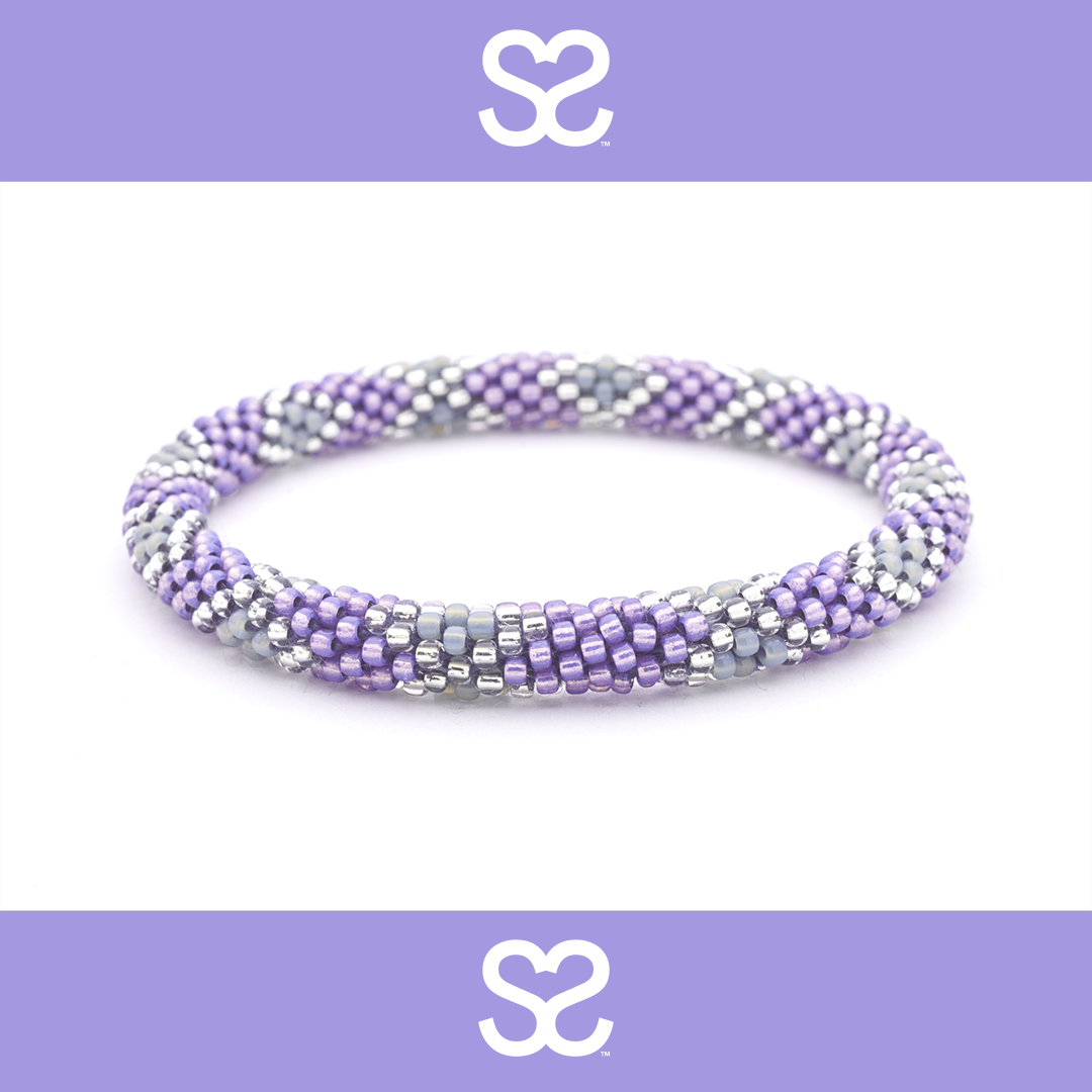 Sashka Co handmade friendship bracelet with purple, gray, and clear glass beads in a diamond pattern. Made in Nepal.