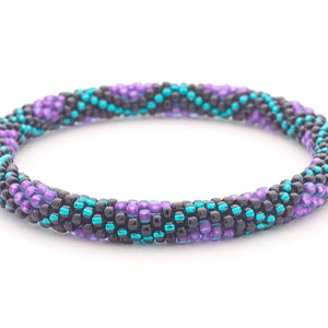 Sashka Co handmade beaded friendship bracelet with purple, teal, and black glass beads. Crafted in Nepal by skilled artisans in a criss cross diamond pattern.