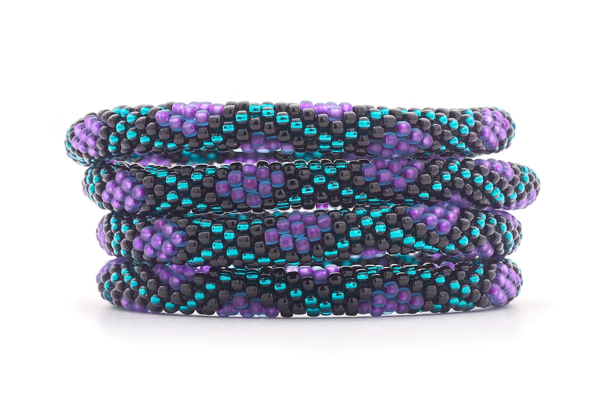 Sashka Co handmade beaded friendship bracelet with purple, teal, and black glass beads. Crafted in Nepal by skilled artisans in a criss cross diamond pattern.