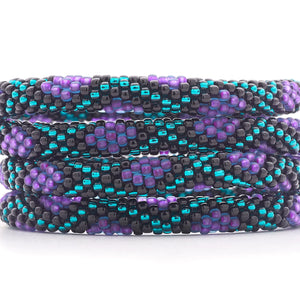 Sashka Co handmade beaded friendship bracelet with purple, teal, and black glass beads. Crafted in Nepal by skilled artisans in a criss cross diamond pattern.