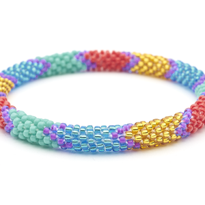 Sashka Co handmade beaded friendship bracelet with red, turquoise, blue, purple, and gold glass beads. Crafted in Nepal by skilled artisans.
