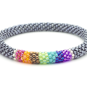 Sashka Co handmade beaded friendship bracelet with silver and chakra-colored line pattern. Crafted in Nepal by skilled artisans.