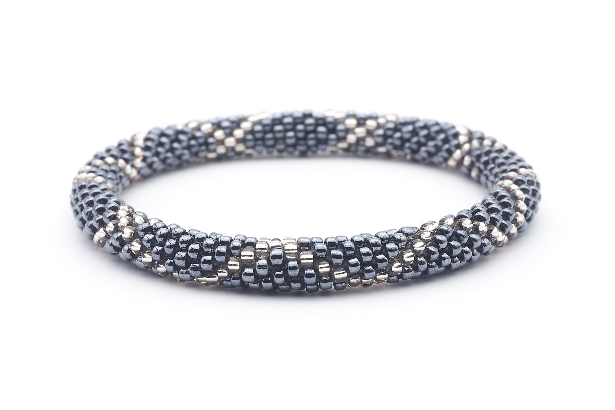 Sashka Co handmade beaded friendship bracelet with silver and clear glass beads. Crafted in Nepal by skilled artisans in a criss cross pattern.