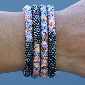 Sashka Co handmade beaded friendship bracelet with silver confetti mix glass beads. Crafted in Nepal by skilled artisans in a half-and-half pattern.