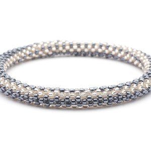 Sashka Co handmade beaded friendship bracelet with silver and rose gold glass beads. Crafted in Nepal by skilled artisans in a zipper pattern.

