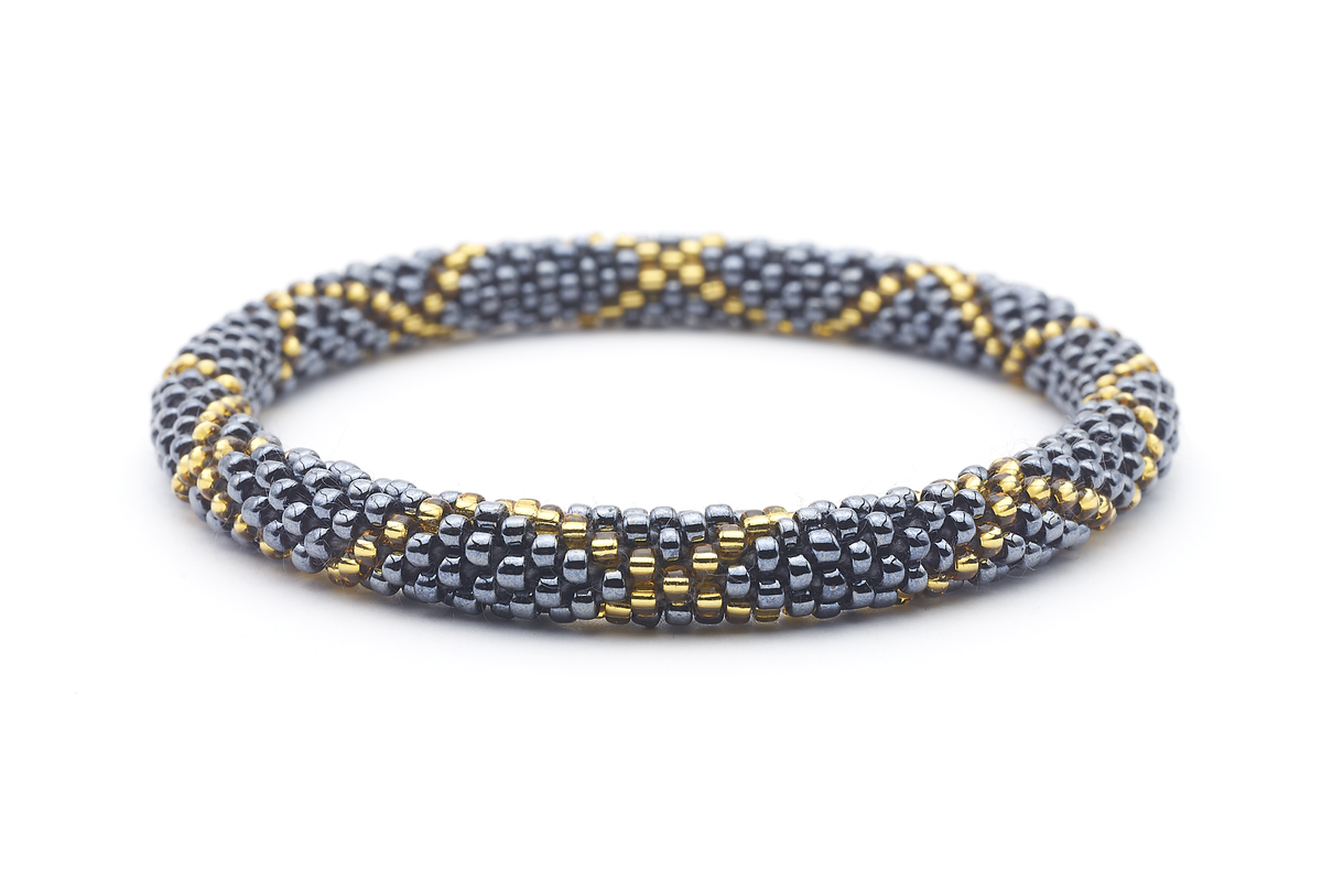 Sashka Co handmade beaded friendship bracelet with slate gold glass beads. Crafted in Nepal by skilled artisans in a criss cross pattern.