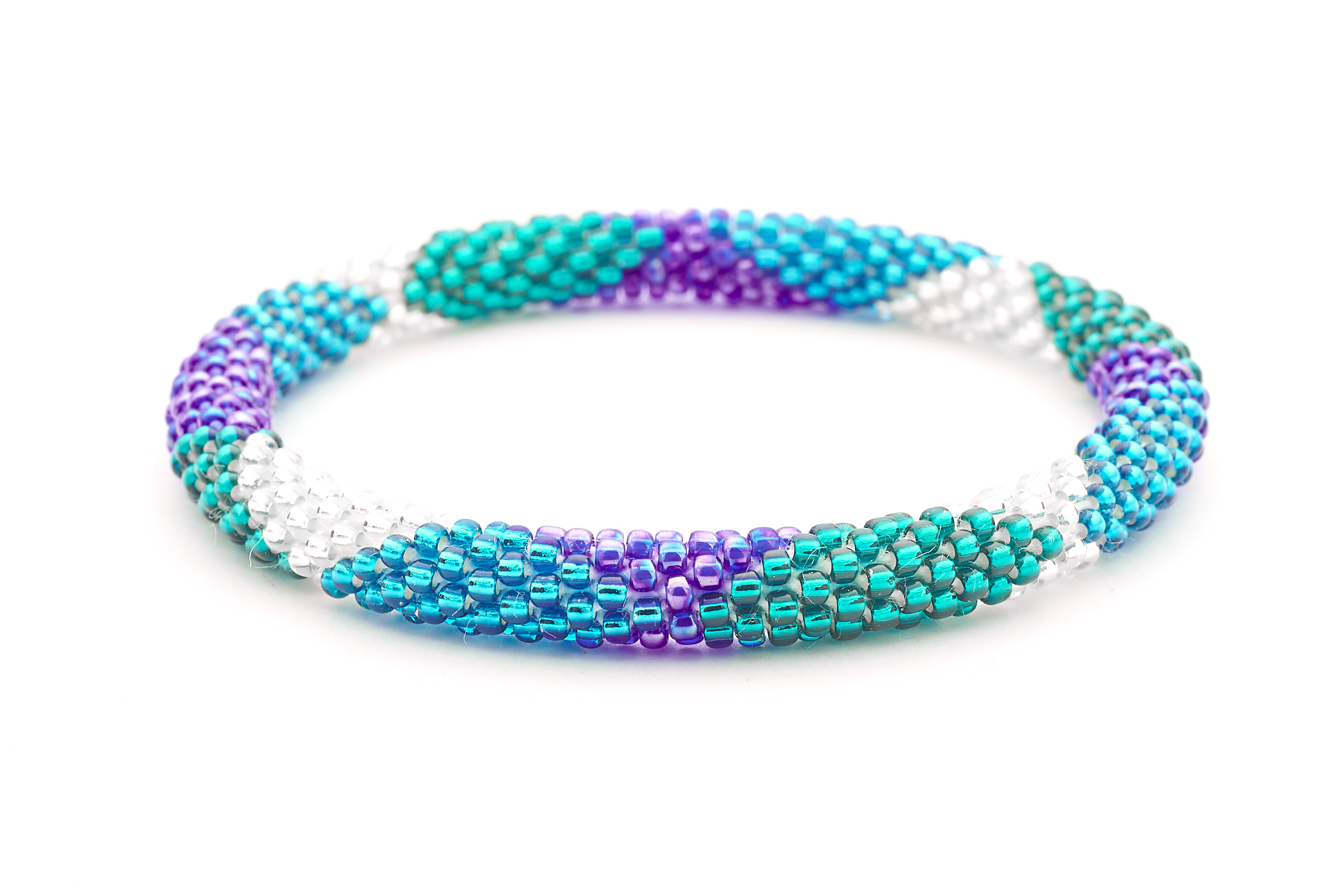 Sashka Co handmade beaded friendship bracelet with teal, clear, blue, and iridescent blue glass beads. Crafted in Nepal by skilled artisans in a large diamond pattern.