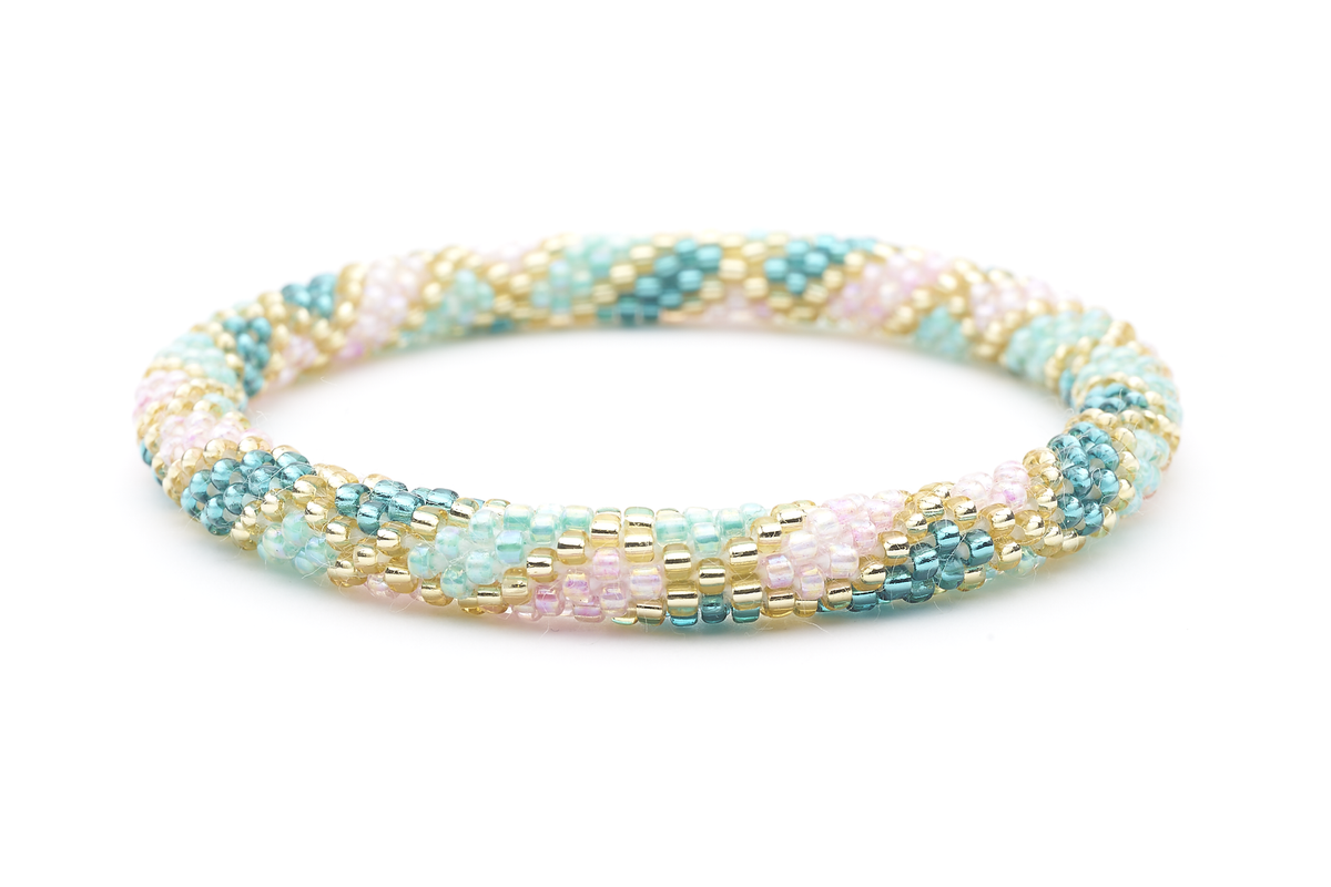 Sashka Co handmade beaded friendship bracelet with teal, gold, iridescent rose, and mint glass beads. Crafted in Nepal by skilled artisans in a criss cross pattern.