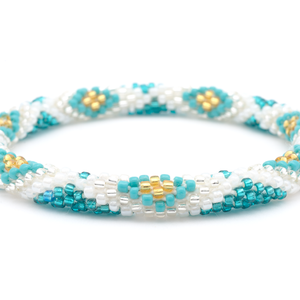 Sashka Co handmade beaded friendship bracelet with teal, turquoise, gold, and clear glass beads. Crafted in Nepal by skilled artisans.