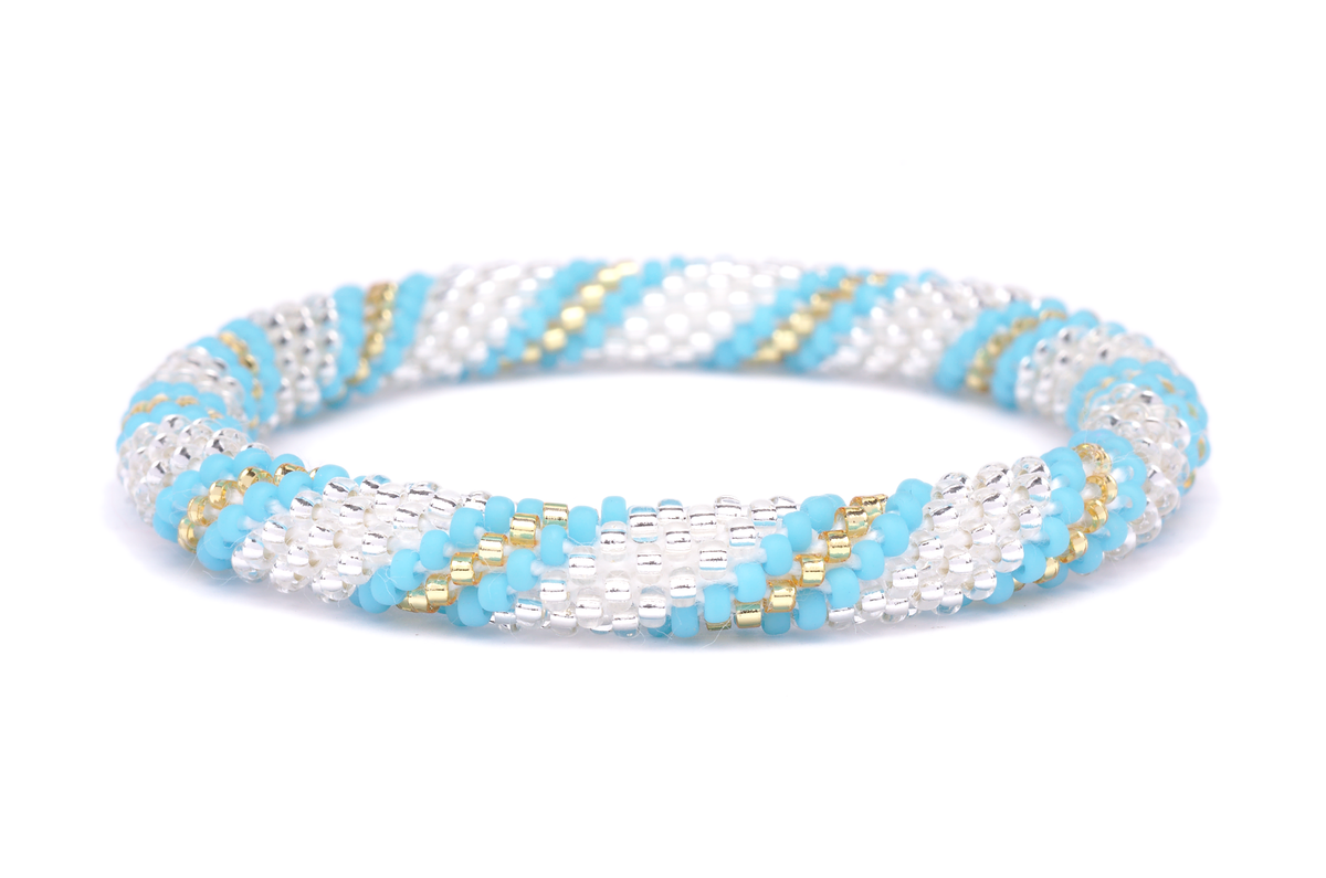 Sashka Co handmade beaded friendship bracelet with turquoise, clear, and champagne gold glass beads. Crafted in Nepal by skilled artisans in a spiral pattern.