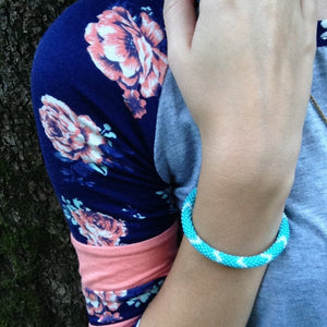 Sashka Co handmade beaded friendship bracelet with turquoise and gray glass beads. Crafted in Nepal by skilled artisans.