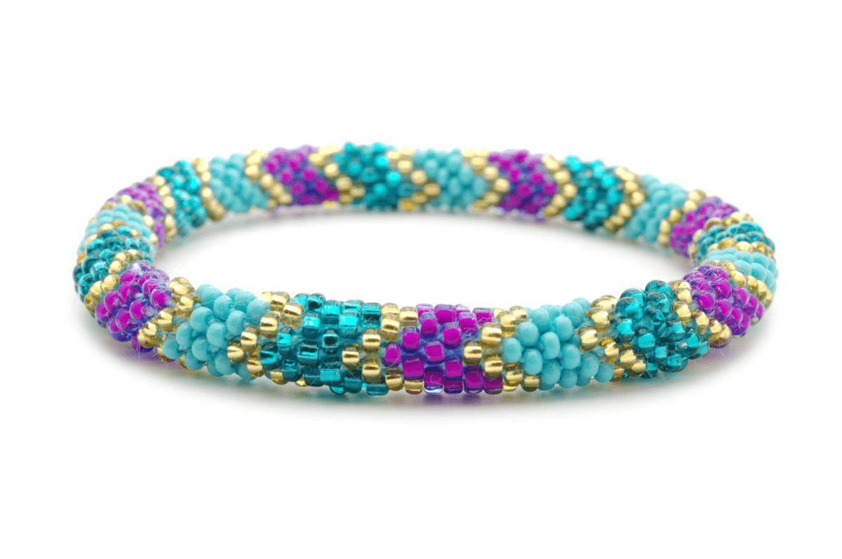 Sashka Co handmade beaded friendship bracelet with turquoise, purple, gold, and teal glass beads. Crafted in Nepal by skilled artisans in a detailed chevron pattern.