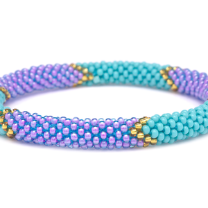 Sashka Co handmade beaded friendship bracelet with turquoise, purple, and gold chevron pattern. Crafted in Nepal by skilled artisans.