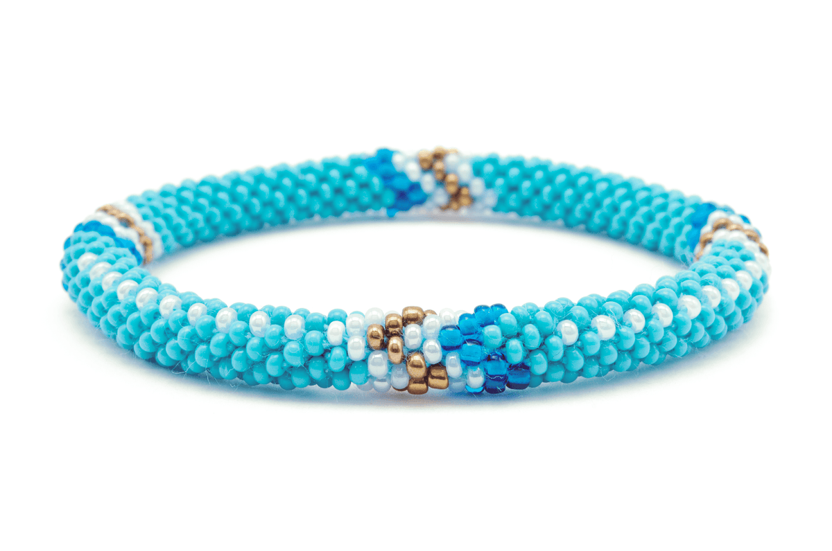 Sashka Co handmade beaded friendship bracelet with turquoise, white, bronze, and blue glass beads. Crafted in Nepal by skilled artisans in an arrow pattern.