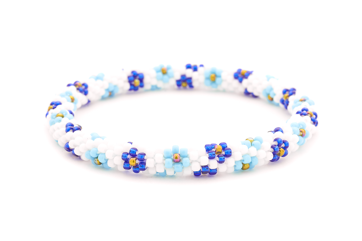 Sashka Co handmade beaded friendship bracelet with white, baby blue, blue, and iridescent flower pattern. Crafted in Nepal.