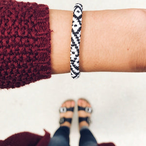 Sashka Co handmade beaded friendship bracelet with white and black diamond pattern. Artisan-crafted in Nepal.