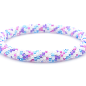 Sashka Co handmade beaded friendship bracelet with white, blue, pink, and purple glass beads. Crafted in Nepal by skilled artisans in a spiral confetti pattern.