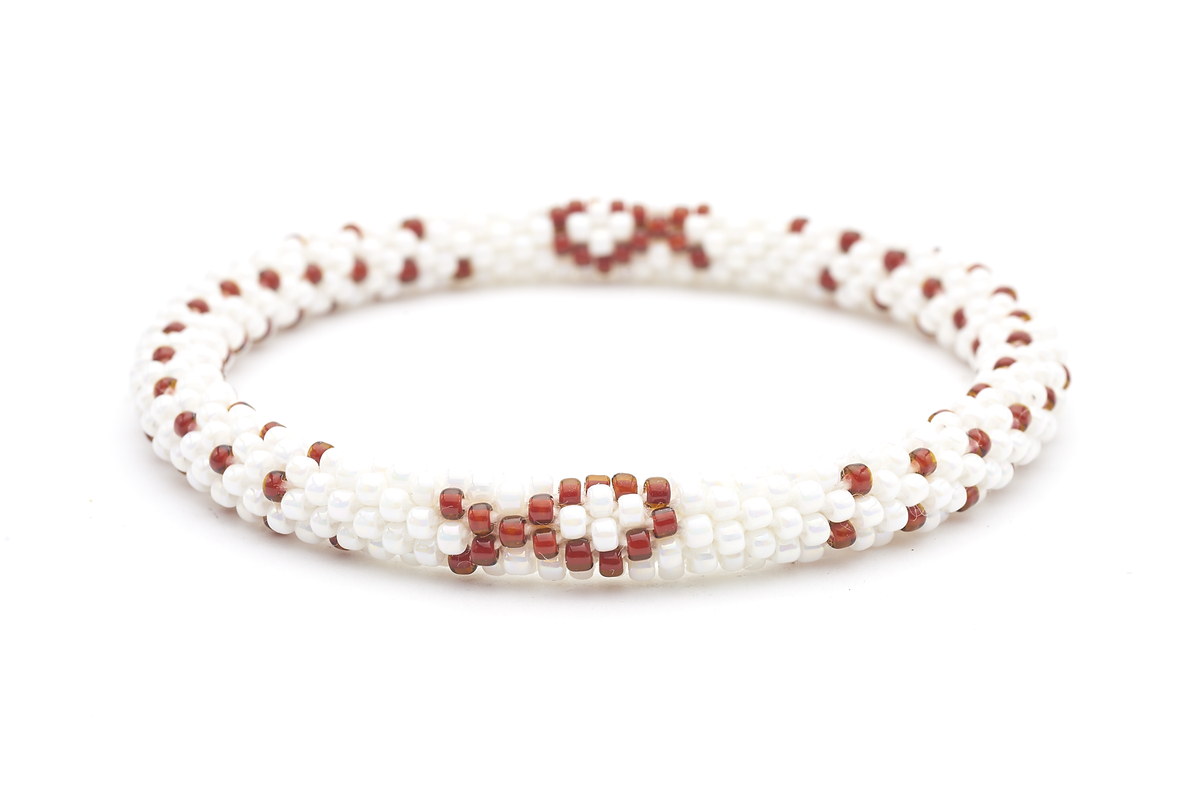 Sashka Co handmade beaded friendship bracelet with white and brown glass beads. Crafted in Nepal by skilled artisans in a cancer ribbon pattern.