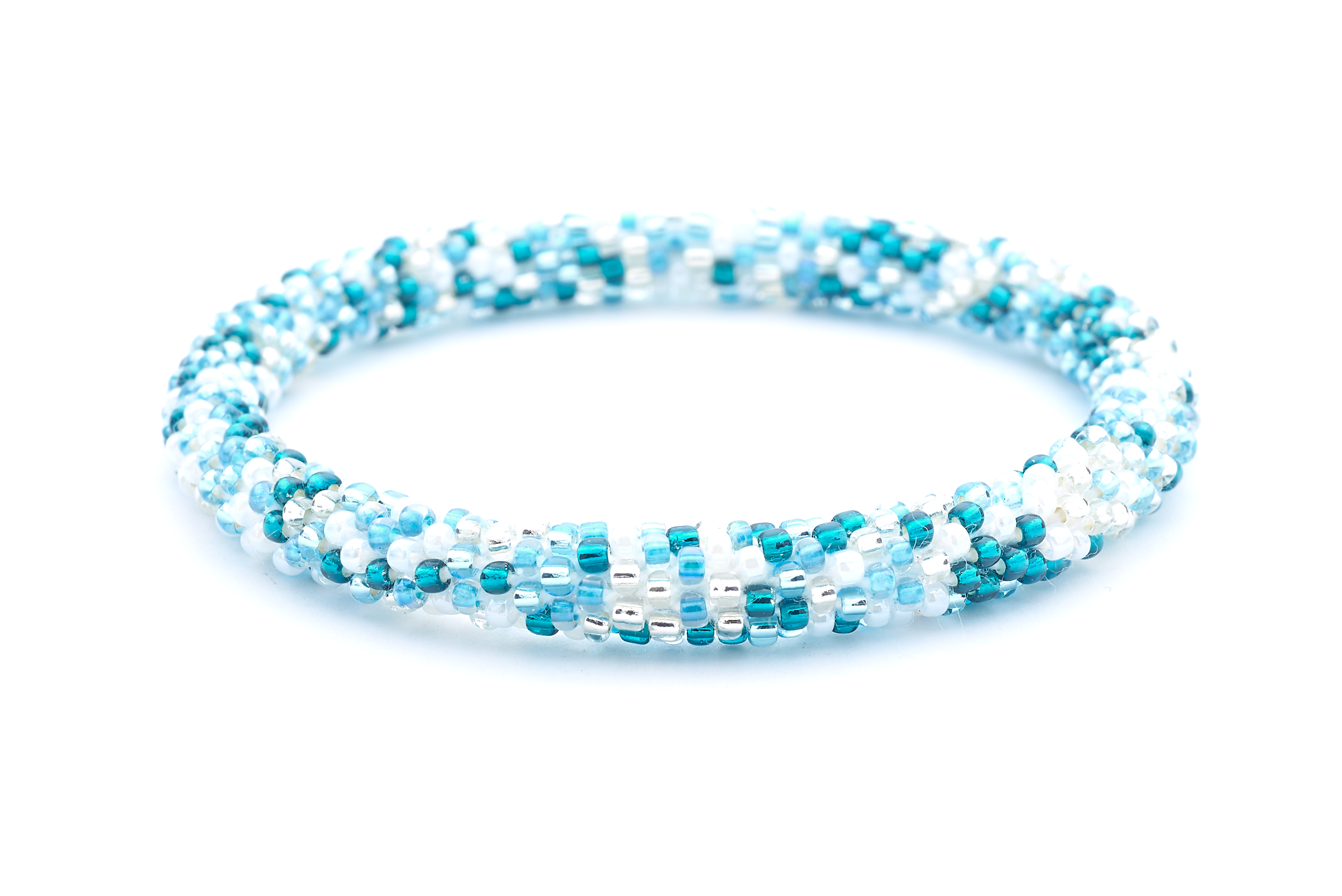 Handmade beaded friendship bracelet with white, clear, light blue, and teal glass beads. Crafted by artisans in Nepal for Sashka Co.