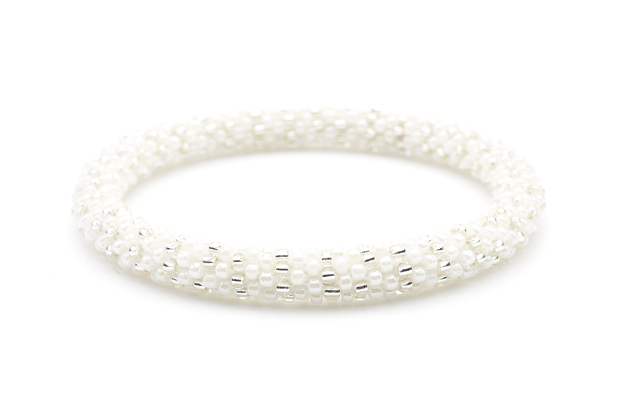 Sashka Co handmade beaded friendship bracelet with white and clear glass beads. Crafted in Nepal by skilled artisans in a detailed line pattern.