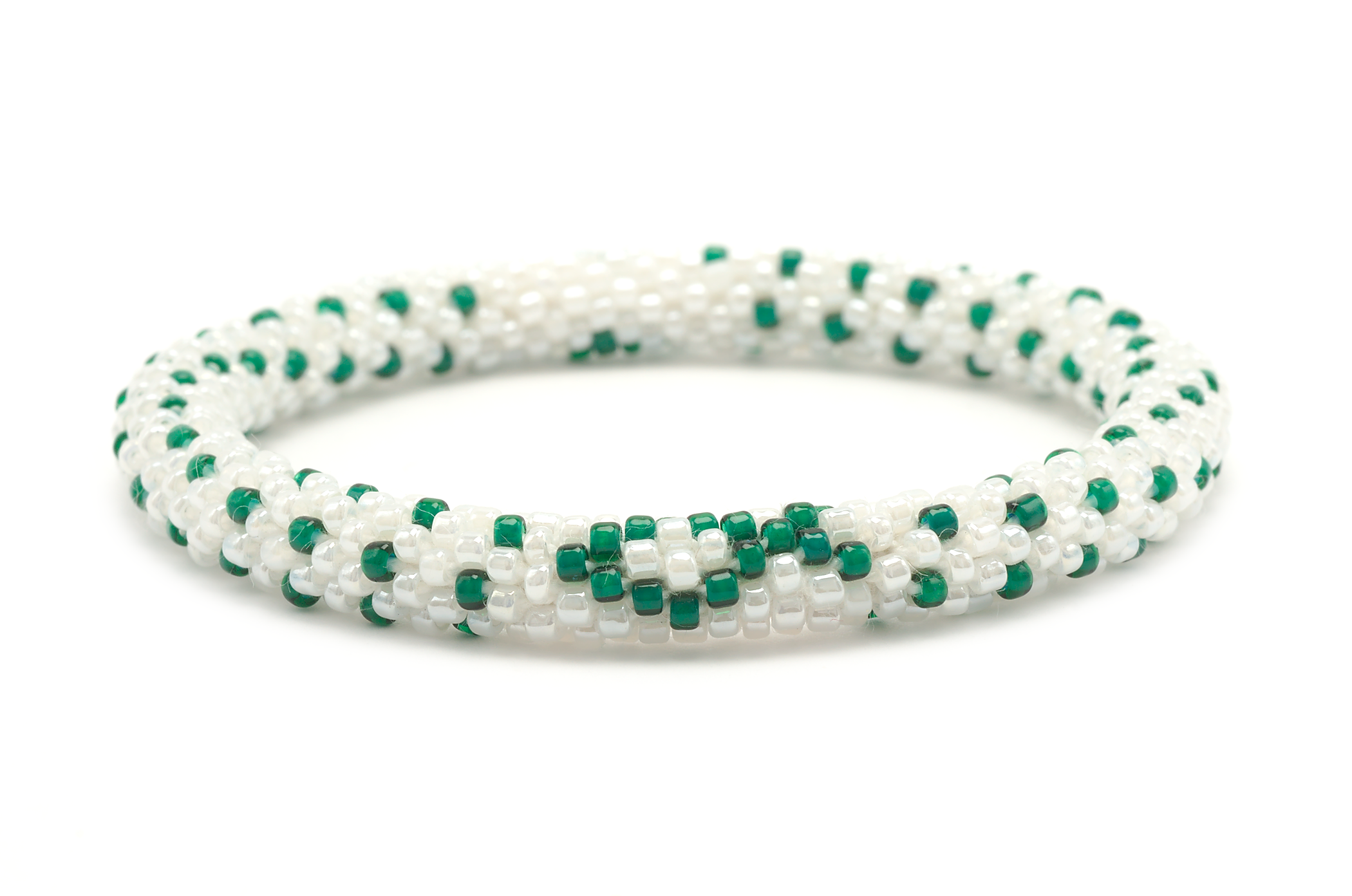 Sashka Co handmade beaded friendship bracelet with white and green glass beads. Crafted in Nepal by skilled artisans in a cancer ribbon pattern.