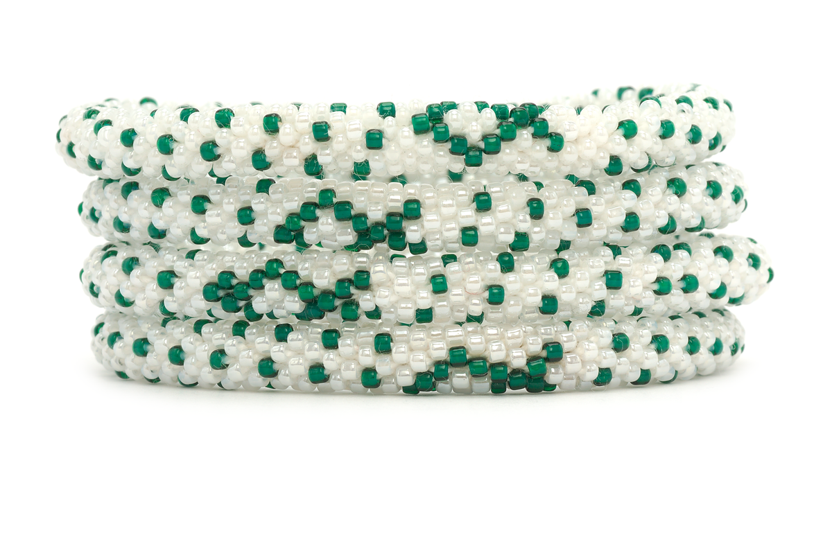 Sashka Co handmade beaded friendship bracelet with white and green glass beads. Crafted in Nepal by skilled artisans in a cancer ribbon pattern.