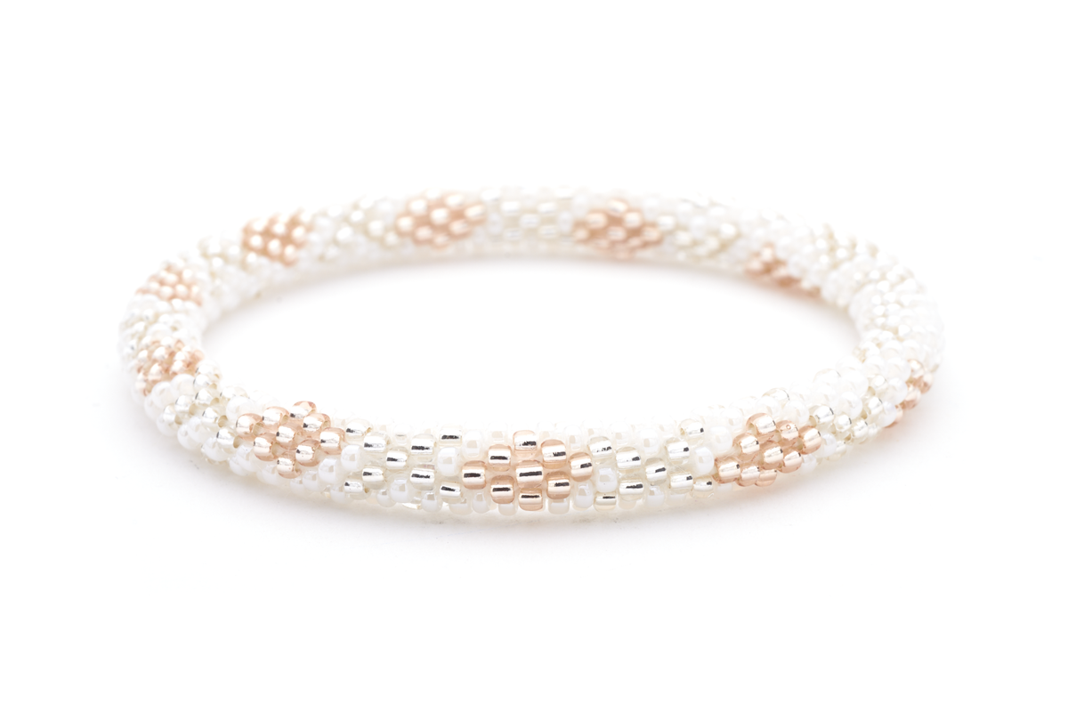 Sashka Co handmade beaded friendship bracelet with white, rose gold, and clear glass beads. Crafted in Nepal by skilled artisans in a diamond pattern.