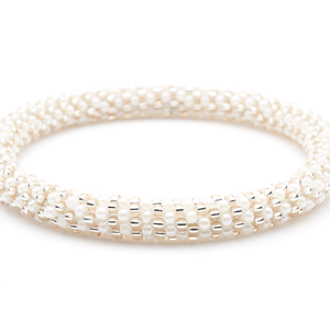 Sashka Co handmade beaded friendship bracelet with white and rose gold glass beads. Crafted in Nepal by skilled artisans in a line pattern.