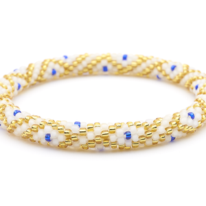Sashka Co handmade beaded friendship bracelet with matte white, gold, and blue glass beads. Crafted in Nepal by skilled artisans in a diamond pattern.