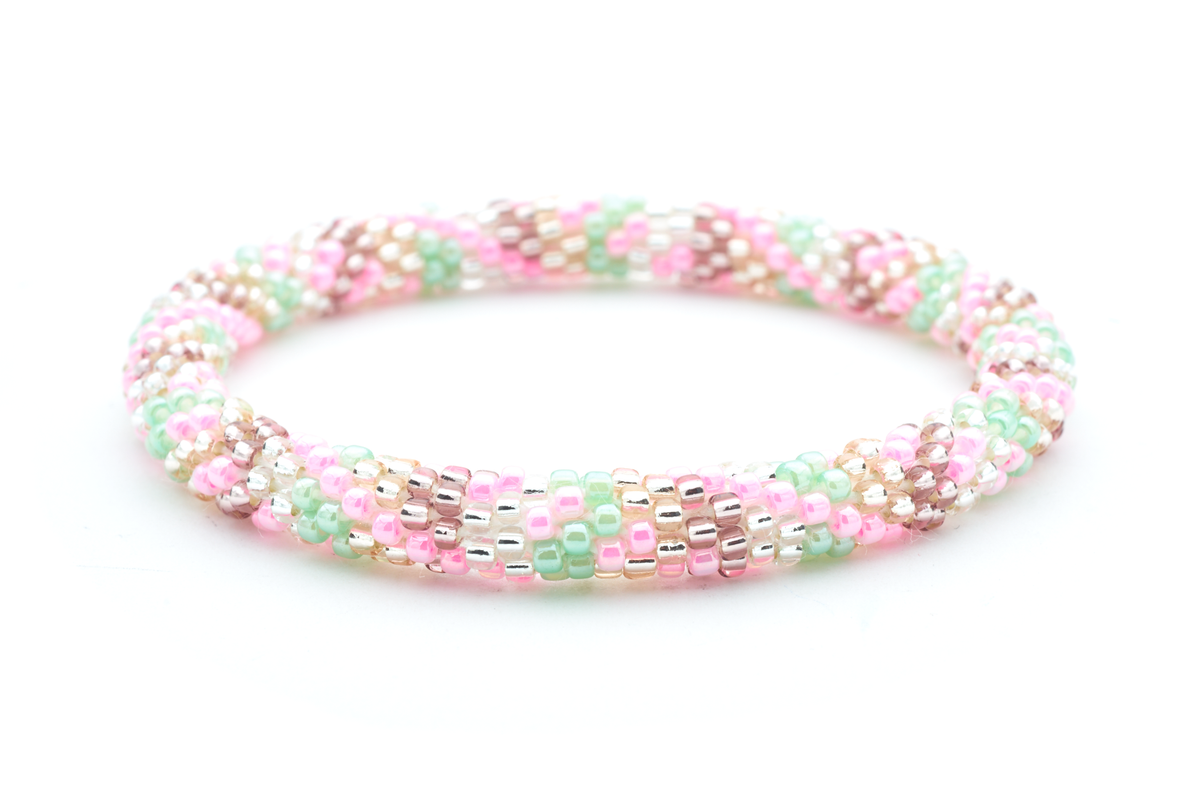 Sashka Co handmade beaded friendship bracelet with pink, mint, purple, clear, and rose gold glass beads. Crafted in Nepal by skilled artisans in a spiral mixed pattern.