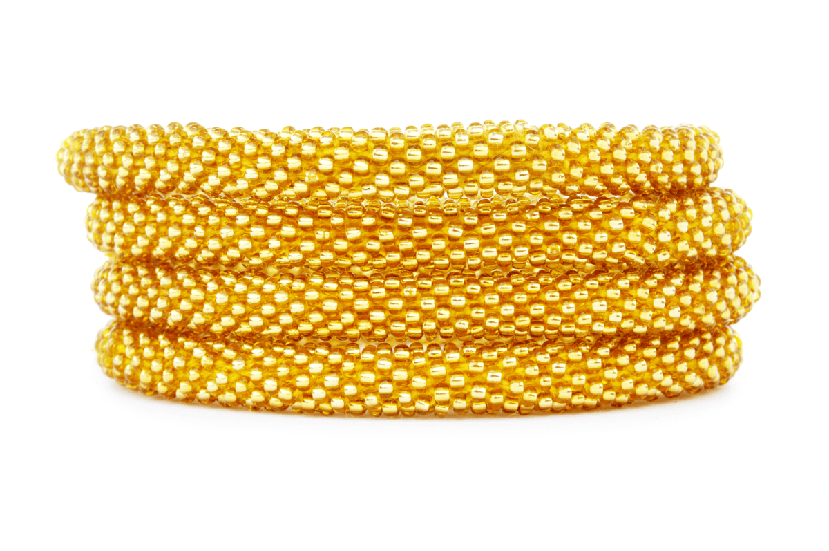 Handmade glass bead gold bracelet from Nepal, featuring a roll design. Also known as a beaded bracelet, seed bead bracelet, beach glass bracelet, or sea glass bracelet