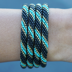 Handmade glass bead Black , Champagne Gold , Turquoise bracelet from Nepal, featuring a roll design. Also known as a beaded bracelet, seed bead bracelet, beach glass bracelet, or sea glass bracelet