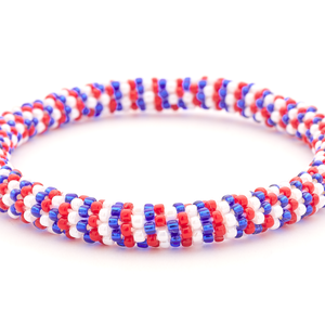 Handmade Beaded friendship bracelet with red, white and blue glass beads. Crafted by artisans in Nepal for Sashka Co.