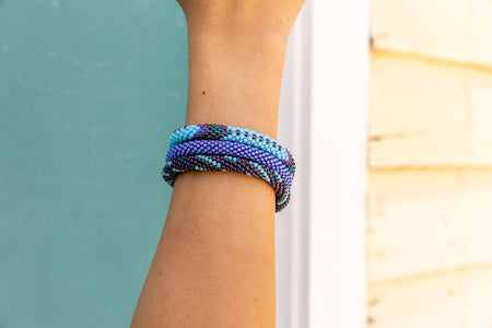 Handmade glass bead bracelet from Nepal, featuring a roll design. Also known as a beaded bracelet, seed bead bracelet, beach glass bracelet, or sea glass bracelet