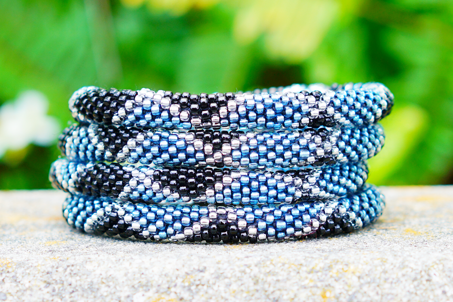 Handmade glass bead bracelet from Nepal, featuring a roll design. Also known as a beaded bracelet, seed bead bracelet, beach glass bracelet, or sea glass bracelet.