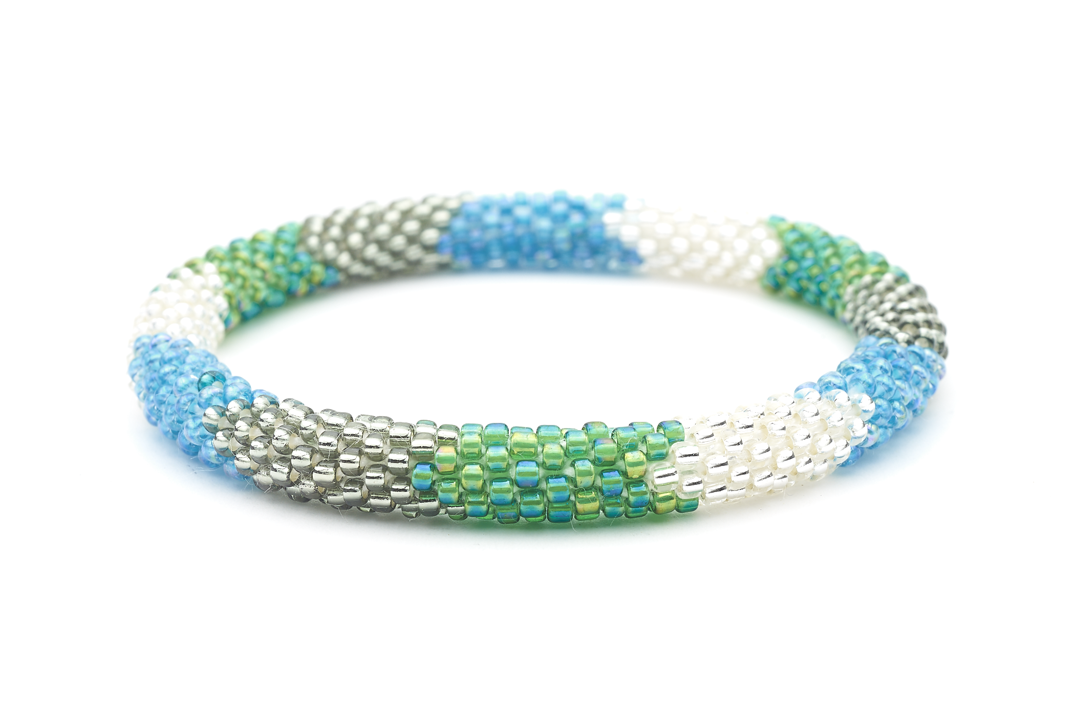 Sashka Co handmade beaded friendship bracelet with iridescent blue, silver, iridescent green, and clear glass beads. Crafted in Nepal by skilled artisans in a detailed chevron pattern.
