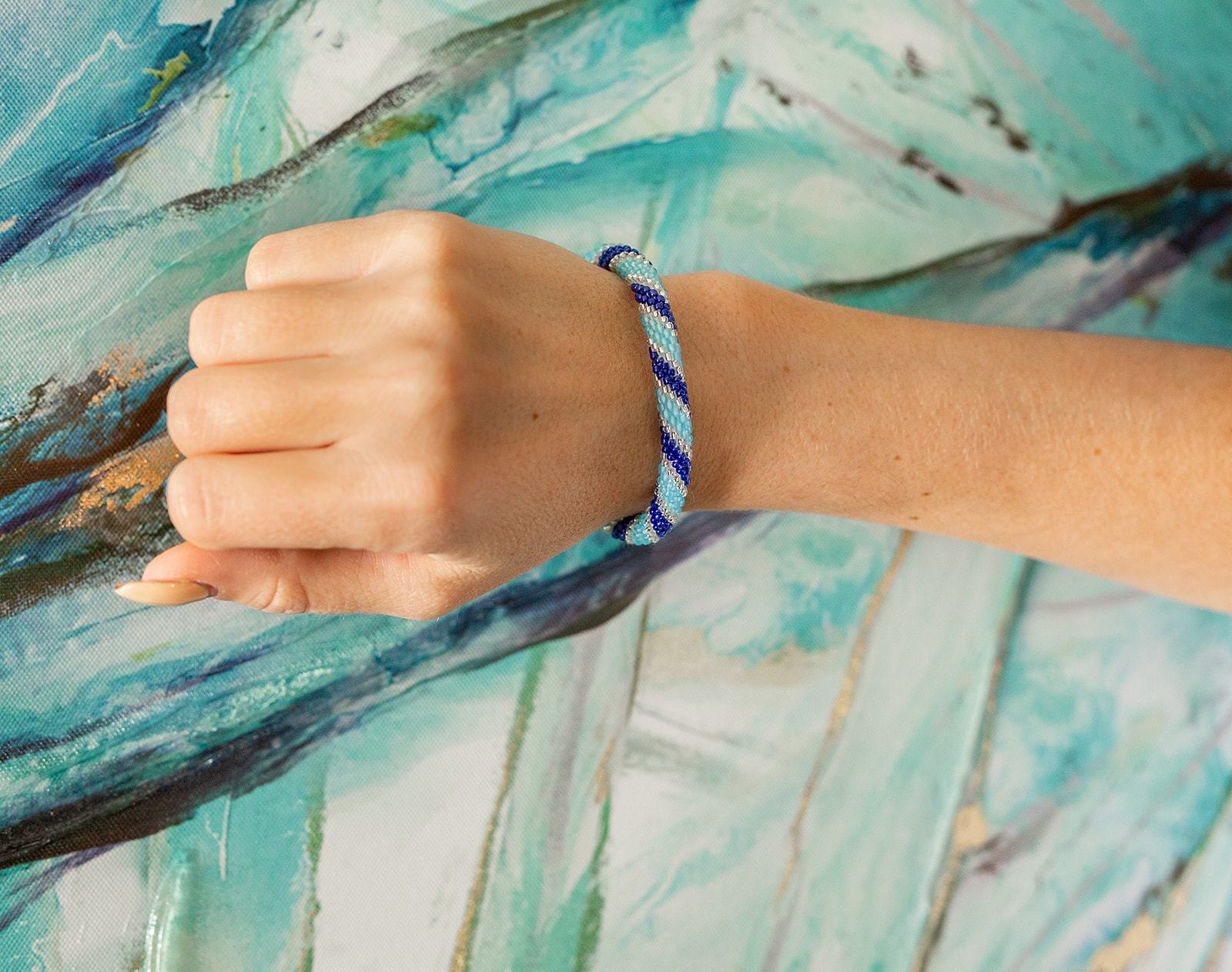 Handmade glass bead bracelet from Nepal, featuring a roll design. Also known as a beaded bracelet, seed bead bracelet, beach glass bracelet, or sea glass bracelet.