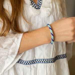 Handmade glass bead bracelet from Nepal, featuring a roll design. Also known as a beaded bracelet, seed bead bracelet, beach glass bracelet, or sea glass bracelet.