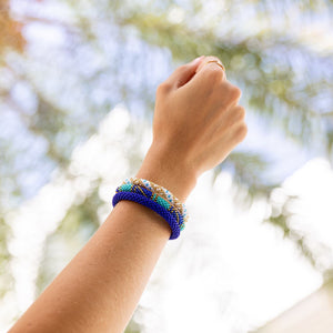 Handmade glass bead bracelet from Nepal, featuring a roll design. Also known as a beaded bracelet, seed bead bracelet, beach glass bracelet, or sea glass bracelet.