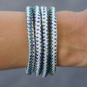 Handmade glass bead bracelet from Nepal, featuring a roll design. Also known as a beaded bracelet, seed bead bracelet, beach glass bracelet, or sea glass bracelet.