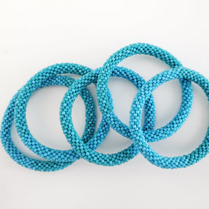 Handmade glass bead bracelet from Nepal, featuring a roll design. Also known as a beaded bracelet, seed bead bracelet, beach glass bracelet, or sea glass bracelet