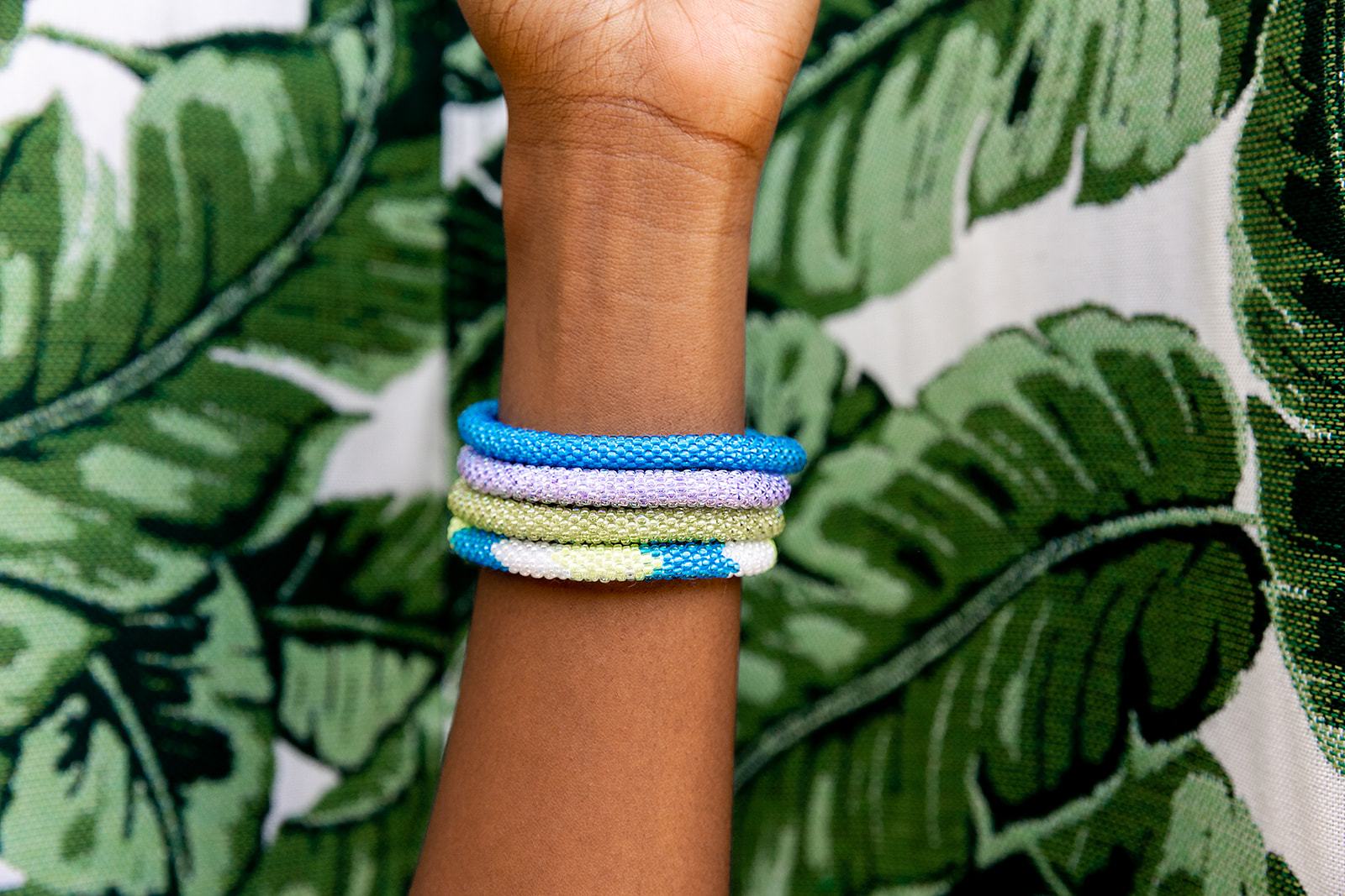 Handmade glass bead bracelet from Nepal, featuring a roll design. Also known as a beaded bracelet, seed bead bracelet, beach glass bracelet, or sea glass bracelet.